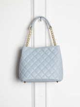 Small quilted leather bag with gold detail